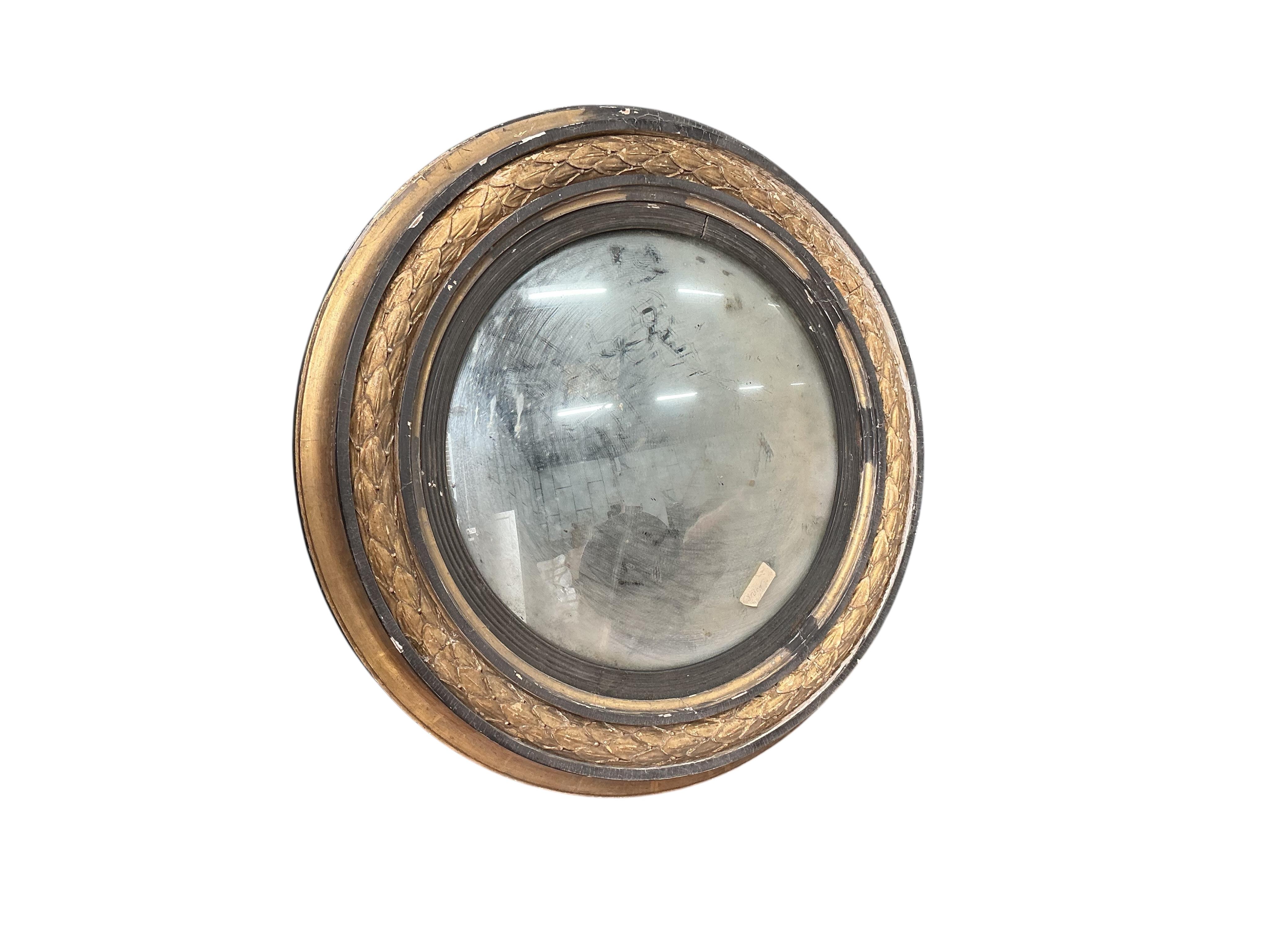 A Regency giltwood and composition circular convex wall mirror, in need of restoration, diameter 70cm